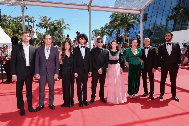 CANNES, FRANCE - MAY 21: Alex Coco, Karren Karagulian, Samantha Quan, Mark Eydelshteyn, Sean S. Baker, Mikey Madison, Darya Ekamasova, Jurij Borisov and Vache Tovmasyan attend the 