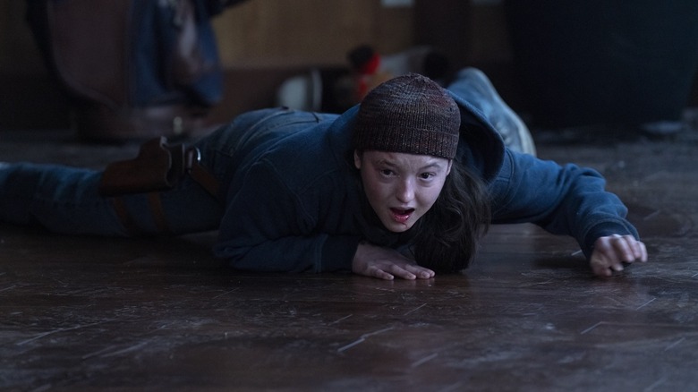 Ellie hysterically crying and screaming while pinned to the floor on The Last of Us