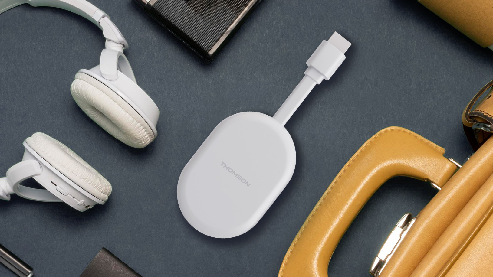 thomson cast 150 lifestyle dongle official A lifestyle photo of the Thomson Cast 150 Google TV streaming dongle.