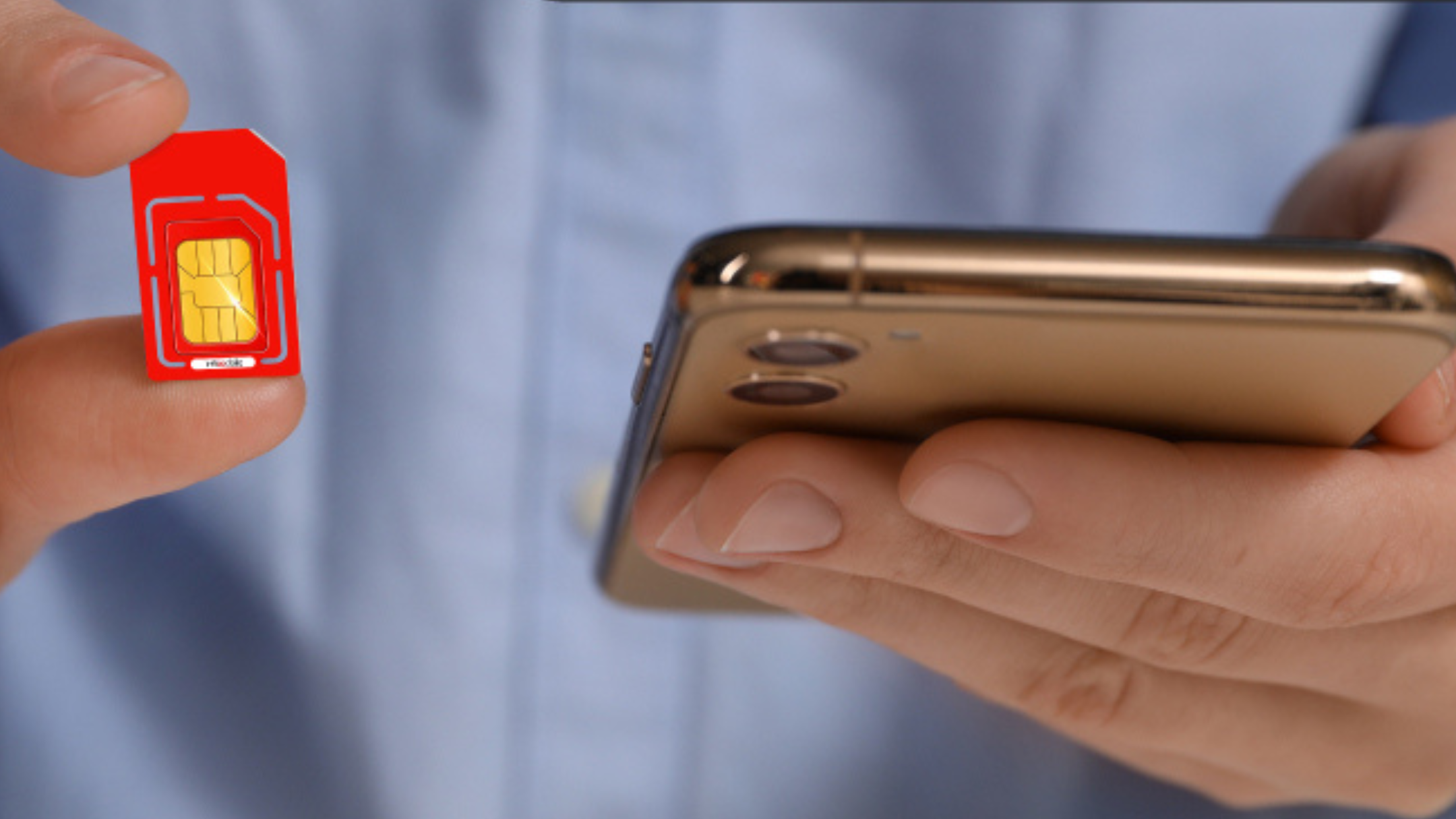 person with Infimobile SIM in hand next to phone