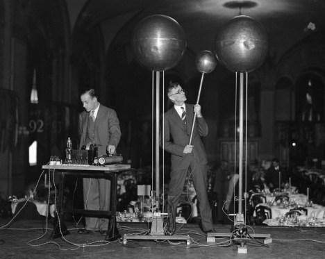 Two scientists demonstrate the Dr. Robert Van De Graf 1,500,000 volt generator.