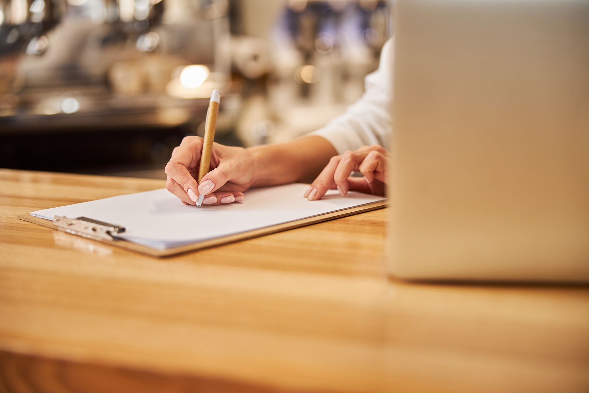 Image of wooden desk with clipboard on it