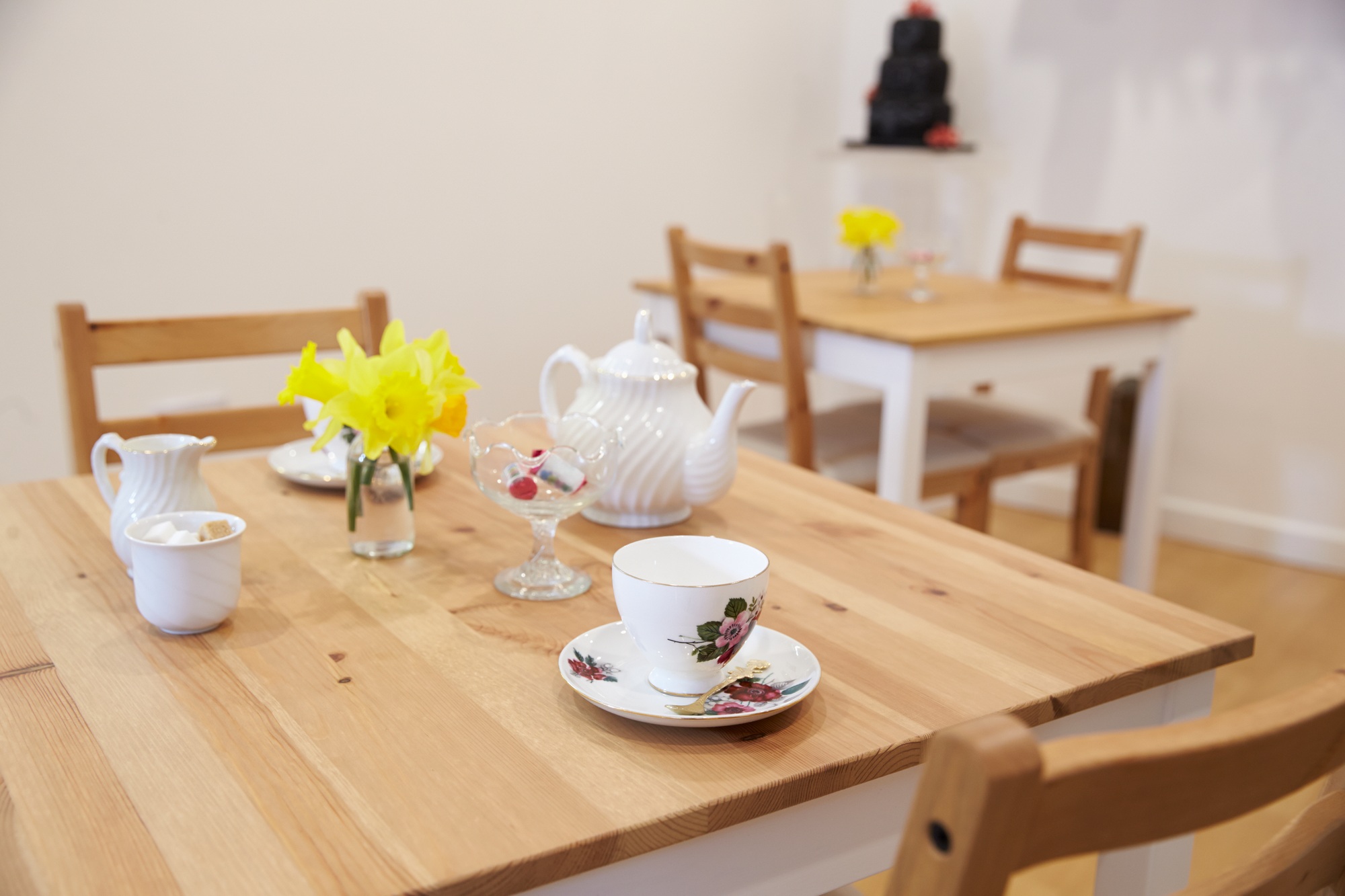 Interior Of Empty Tea Shop With Tables And Crockery