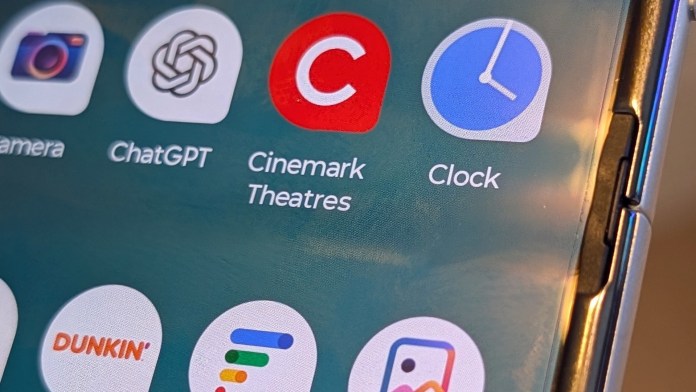 Close-up view of the external display of the Motorola Razr 2025, showcasing app icons including Camera, ChatGPT, Cinemark Theatres, and Clock.