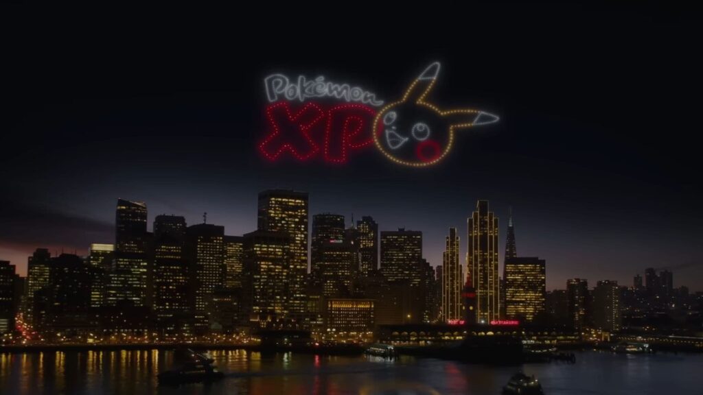 PokémonXP logo in drone light show above San Francisco skyline