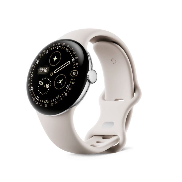 A sleek smartwatch with a domed display, featuring various digital watch face elements and a soft beige strap.