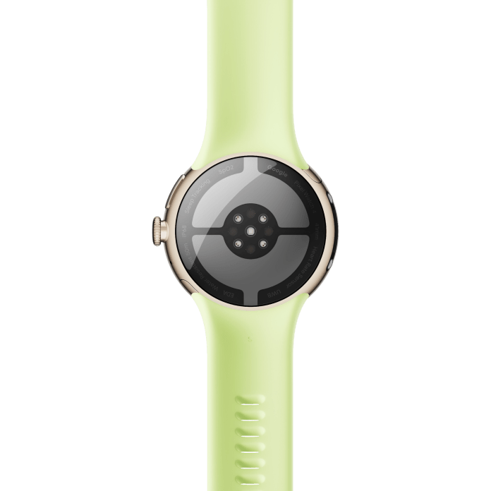 Close-up of the back view of the Pixel Watch 4 in a light green strap, showcasing its sensors and design.