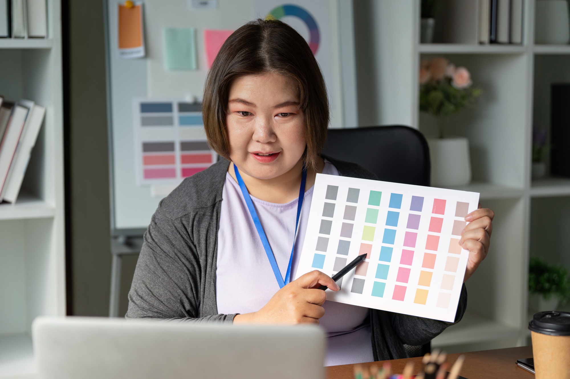 Graphic designer presenting color swatches for branding and visual identity