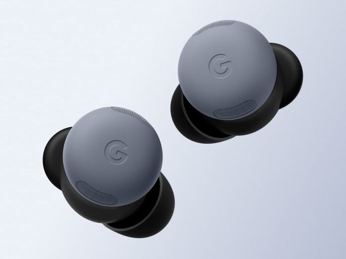 A top-down view of two Pixel Buds 2a wireless earbuds, one in light gray and the other in black, showcasing their sleek design and distinctive Google logo.