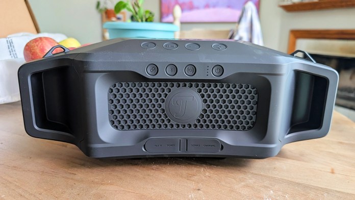 Front view of the Fender x Teufel ROCKSTER CROSS Bluetooth speaker, showcasing its rugged design, mesh grille, and control buttons.