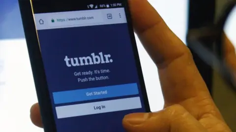 Getty Images A user accesses a Tumblr account on a smartphone